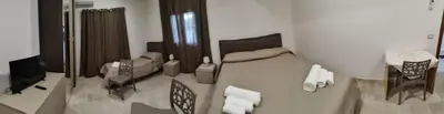 Letto o letti in una camera di villa corinzia