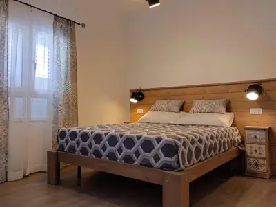 Letto o letti in una camera di Sicilia Meraviglia B&B