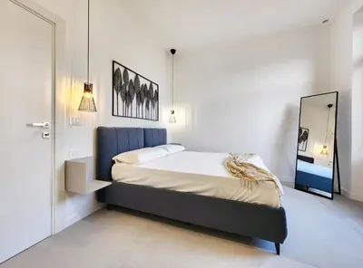 Letto o letti in una camera di Matteotti Royale Apartments