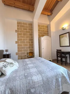 Letto o letti in una camera di Avola Opera House