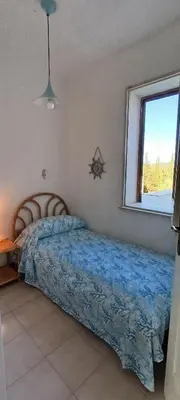 Letto o letti in una camera di Perla Marina Casa Vacanze