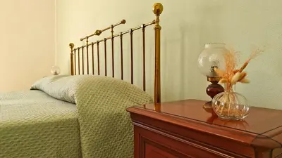 Letto o letti in una camera di Al Pianotto, appartamento vintage ad Avola, vista Mare