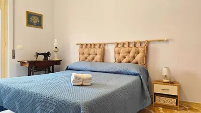 Letto o letti in una camera di Al Pianotto, appartamento vintage ad Avola, vista Mare