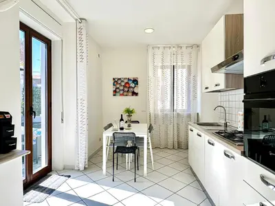 Cucina o angolo cottura di KataSoul Home Vacation - Terrazza - Centro Storico - 2 Camere - 6 Posti letto