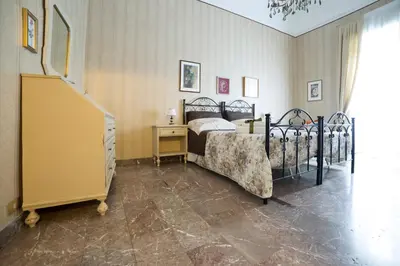 Letto o letti in una camera di I Balconi sul Barocco
