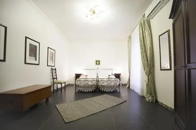 Letto o letti in una camera di I Balconi sul Barocco