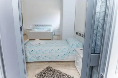 Letto o letti in una camera di villa corinzia 2