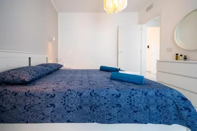Letto o letti in una camera di Porto Ammare apartment - SiciliaVacanza