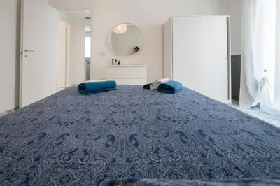 Letto o letti in una camera di Porto Ammare apartment - SiciliaVacanza