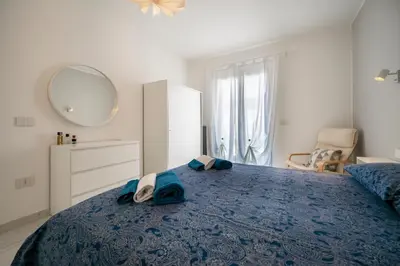 Letto o letti in una camera di Porto Ammare apartment - SiciliaVacanza