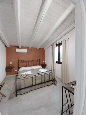 Letto o letti in una camera di Green House La Torre