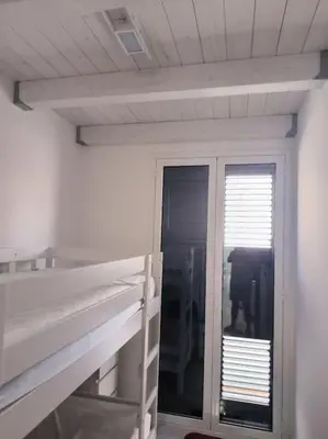 Letto o letti in una camera di Blu Mare