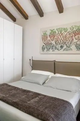 Letto o letti in una camera di Casa Dona - Essenza