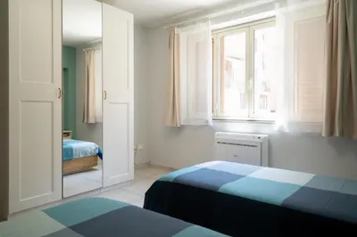 Letto o letti in una camera di GuestHost - Urban Experience Syracuse