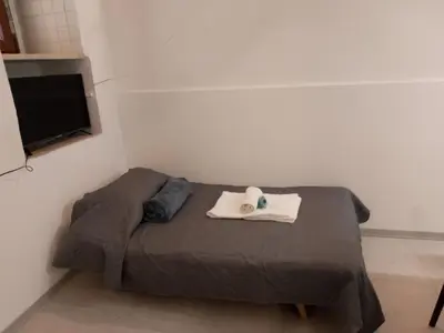 Letto o letti in una camera di Casa vacanze Eugenia