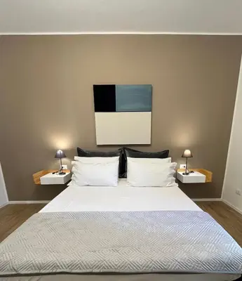 Letto o letti in una camera di Domus Lucia