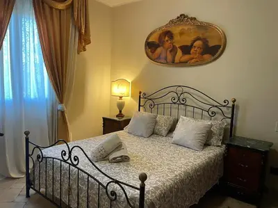 Letto o letti in una camera di Brunello con veranda e piscina condivisa