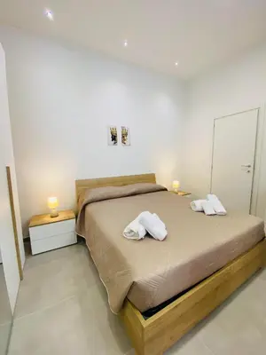 Letto o letti in una camera di Il Cortiletto Casa Vacanze