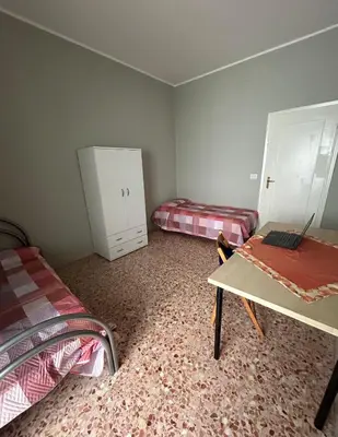 Letto o letti in una camera di Casa Salerno