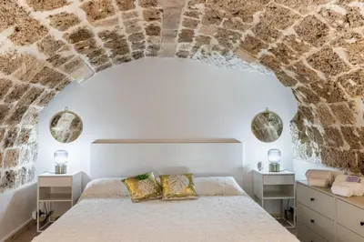 Letto o letti in una camera di TEMPO DI NOTO