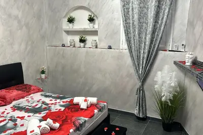 Letto o letti in una camera di Marilyn Rooms - Suite Catania center