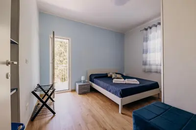 Letto o letti in una camera di Casa Zefiro Fontane Bianche