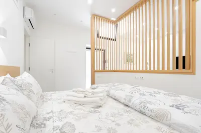 Letto o letti in una camera di Eos - Elegant Apartments & Suites