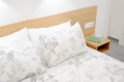 Letto o letti in una camera di Eos - Elegant Apartments & Suites