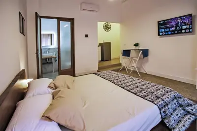Letto o letti in una camera di Tiritù Apartments