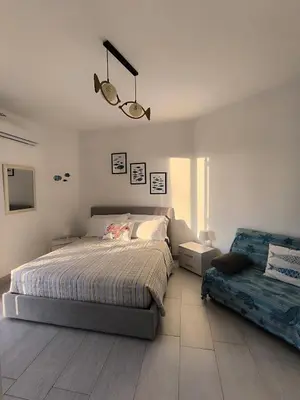 Letto o letti in una camera di Appartamento d' amare vicino il mare