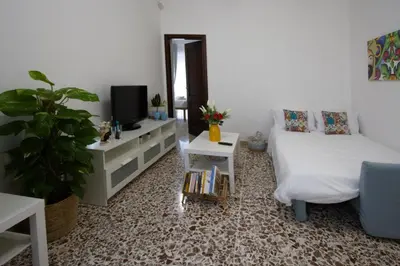 Letto o letti in una camera di AMURI HOUSE- Intero appartamento vicino al MARE e ORTIGIA