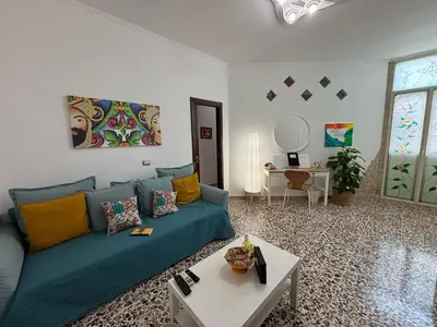 Area soggiorno di AMURI HOUSE- Intero appartamento vicino al MARE e ORTIGIA