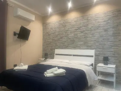 Letto o letti in una camera di Piccolo appartamento