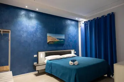 Letto o letti in una camera di Pietre Azzurre Rooms