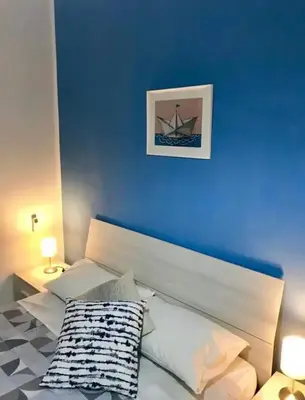 Letto o letti in una camera di Ionio Rooms