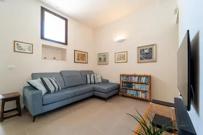 Area soggiorno di GuestHost - Pam's Seaview Apartment