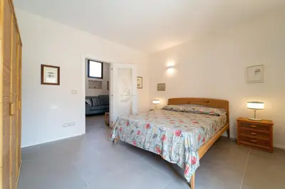 Letto o letti in una camera di GuestHost - Pam's Seaview Apartment