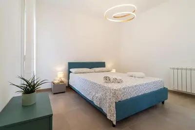 Letto o letti in una camera di GuestHost - Dimora dei Consoli Apartments