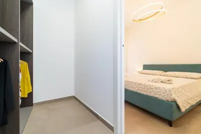 Letto o letti in una camera di GuestHost - Dimora dei Consoli Apartments