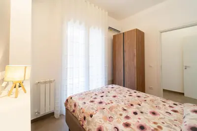 Letto o letti in una camera di GuestHost - Dimora dei Consoli Apartments