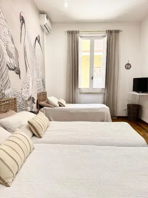 Letto o letti in una camera di Casa Rossini