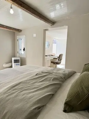 Letto o letti in una camera di Casa Rossini