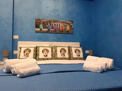 Letto o letti in una camera di Holiday Catania Apartments