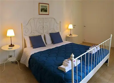 Letto o letti in una camera di House of Flowers Borgata
