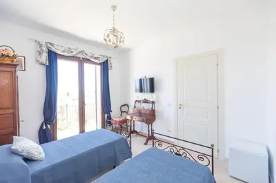 Letto o letti in una camera di Casale Antiche Mura Siracusa