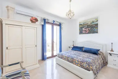 Letto o letti in una camera di Casale Antiche Mura Siracusa