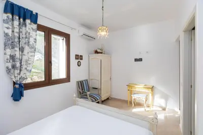 Letto o letti in una camera di Casale Antiche Mura Siracusa