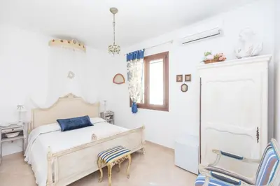Letto o letti in una camera di Casale Antiche Mura Siracusa