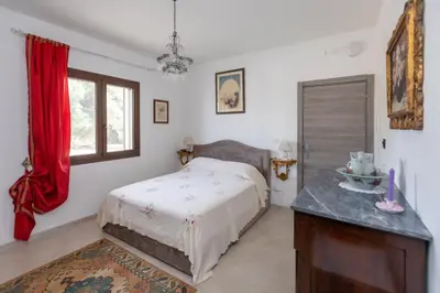 Letto o letti in una camera di Casale Antiche Mura Siracusa