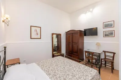 Letto o letti in una camera di Casa Ariadne by Ortigia Apartments